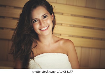 Young Beautiful Woman Having A Sauna Bath In A Steam Room