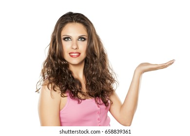 A Young Beautiful Woman Holds An Imaginary Object In Her Hand