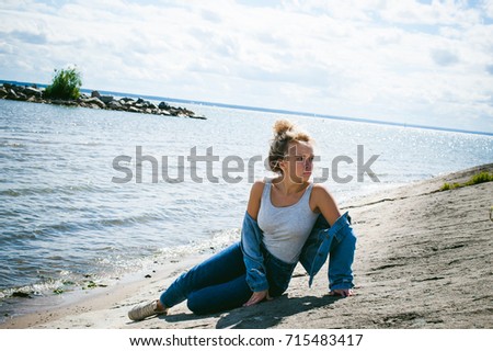 Young woman on the beach in the sun