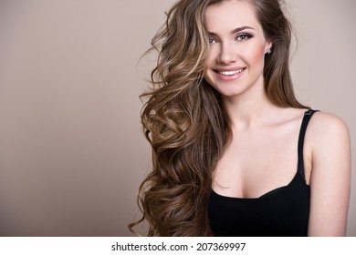 Young Beautiful Woman With Long Curly Hair