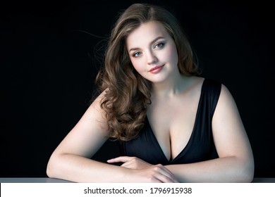 Young Beautiful Woman With Natural Makeup On Black Background. Beauty  Skin Care Concept. Plus Size Model.