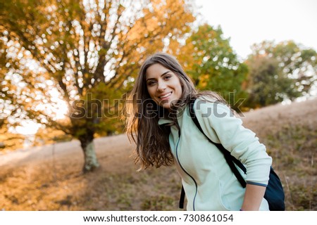 Similar – Happy young woman looking back through the window car