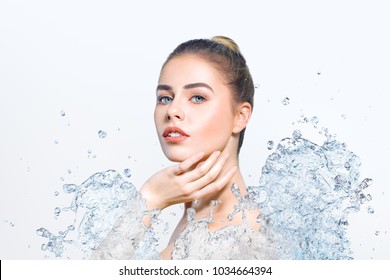 Young beautiful woman portrait with water splash