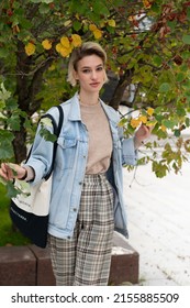 Young Beautiful Woman Pose Outside, Standing In A Blue Jacket