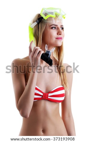 Young beautiful woman posing in red striped swimsuit and diving mask, isolated on white