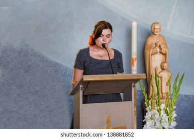 Young Beautiful Woman Preaching In Christian Church