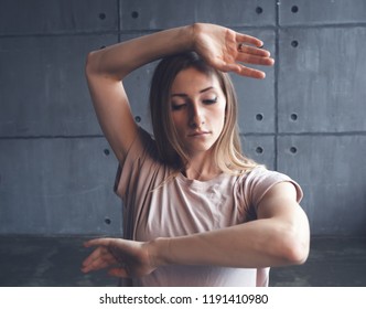 Young Beautiful Woman Professional Dancer Dancing During A Rehearsal In A Dance Studio, Modern Dramatic Style, Experimental Dance