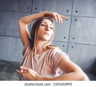 Young Beautiful Woman Professional Dancer Dancing During A Rehearsal In A Dance Studio, Modern Dramatic Style, Experimental Dance