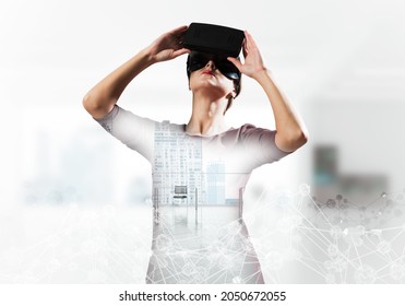 Young And Beautiful Woman In Red Dress Using Virtual Reality Headset With Digital Network Structure While Standing Inside Office. Up To Date Technologies And Double Exposure