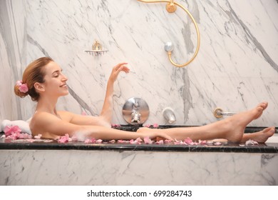 Young Beautiful Woman Relaxing In Bath With Foam