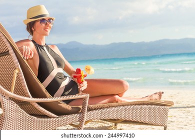 young beautiful woman relaxing on tropical beach, summer vacations