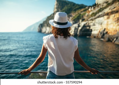 Young beautiful woman relaxing in scenic landscape in Italy. Vacation background