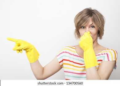 Young Beautiful Woman In Rubber Gloves Holding Her Nose