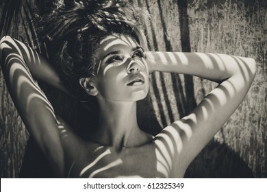 Young Beautiful Woman With Shadows On Face