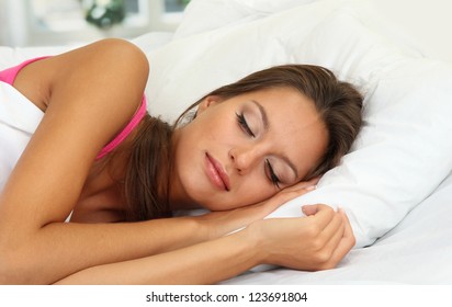 Young Beautiful Woman Sleeping In Bed