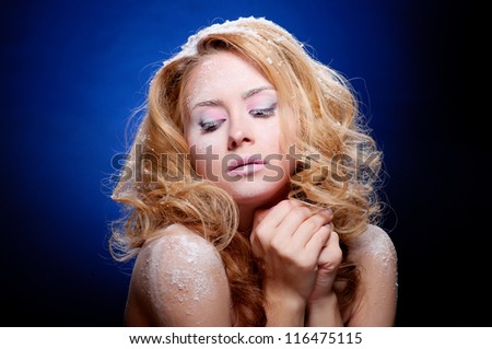 Young beautiful woman with snowy skin (warm colors)