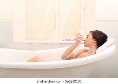 Young Beautiful Woman Taking Bubble Bath