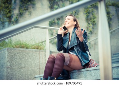young beautiful woman using smart phone in the city