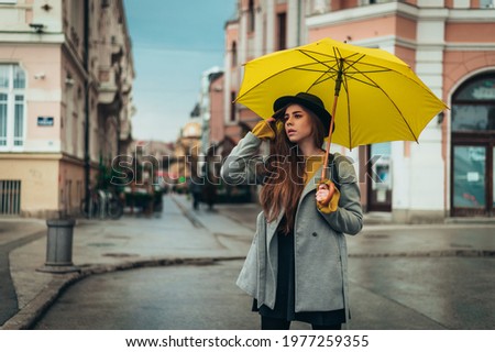 Similar – Blonde thin woman with hat and sunglasses visiting the city during the day.