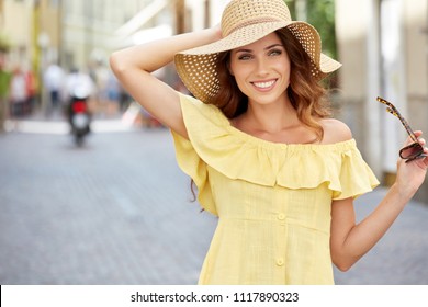 Young beautiful woman walking the streets of an Italian town - Powered by Shutterstock