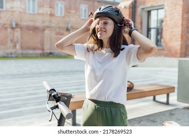 Young Beautiful Woman Wear Bicycle Helmet To Ride Save An Electric Scooter