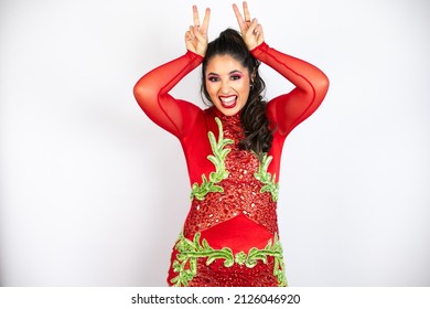 Young beautiful woman wearing carnival costume over isolated white background Posing funny and crazy with fingers on head as bunny ears, smiling cheerful