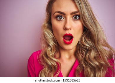 Young Beautiful Woman Wearing Elegant Shirt Standing Over Pink Isolated Background Scared In Shock With A Surprise Face, Afraid And Excited With Fear Expression