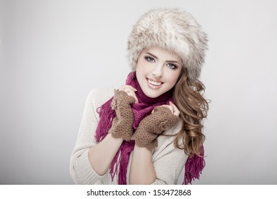 Young Beautiful Woman Wearing Fur Hat And Scarf