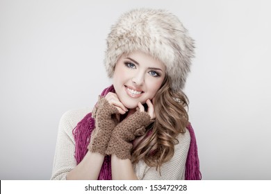 Young Beautiful Woman Wearing Fur Hat And Scarf