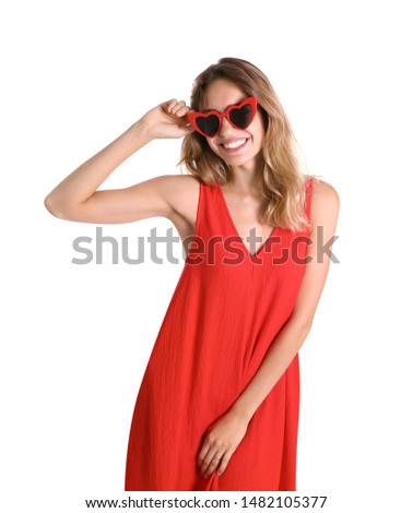 Young beautiful woman wearing heart shaped glasses on white background