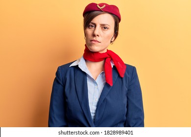 Young Beautiful Woman Wearing Stewardess Uniform Relaxed With Serious Expression On Face. Simple And Natural Looking At The Camera. 