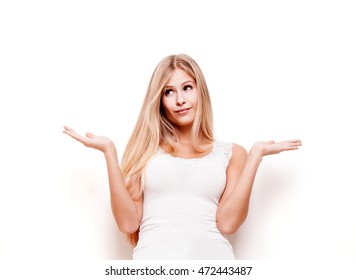 Young Beautiful Woman Weighing The Pros And Cons, Studio Shot Isolated On White Background