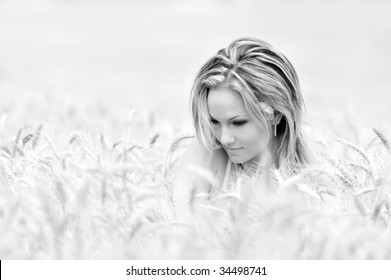 young beautiful woman in wheat field