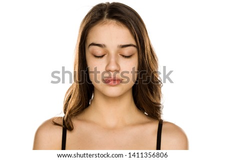 Young beautiful woman without makeup on white background
