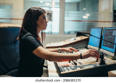 Young Beautiful Woman Working In A Broadcast Control Room On A Tv Station