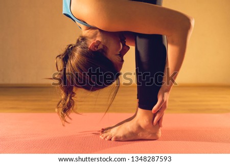 Similar – Image, Stock Photo Young woman stretching legs by sea pier