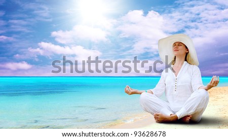 Young beautiful women in the white on the sunny tropical beach