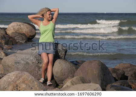 Similar – Young woman and Labrador at the Baltic Sea beach