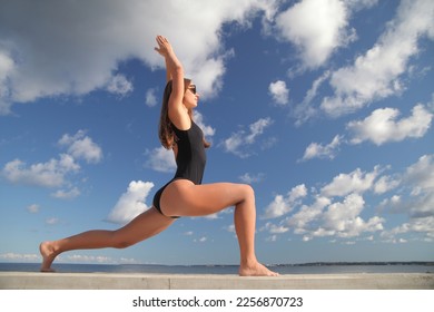 young beauty athletic woman in a swimsuit on the beach - Shutterstock ID 2256870723