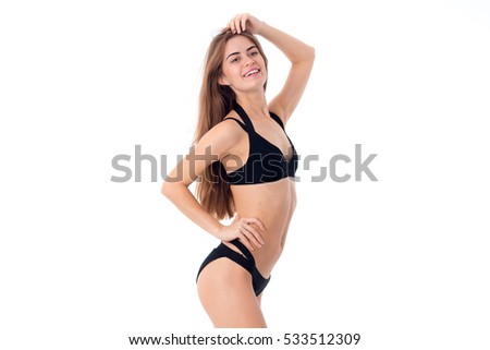 young beauty girl in black swimsuit isolated on white background