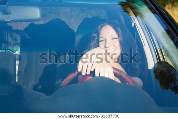 young beauty girl in the\
white car