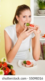 Young Beauty Woman Eating Sandwich With Ham And Vegetables