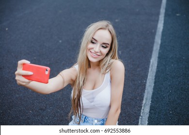 young beauty woman make selfie for self smartphone, outdoor portrait, fashion model, pretty girl, hipster, lips red, make up, close up, beauty street photo, blonde hair, street photo
