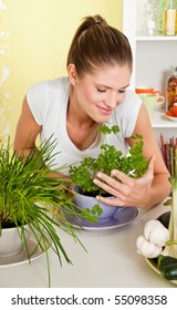 Young Beauty Woman Smelling Parsley