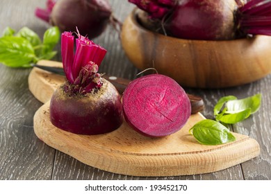 Young beets in a wooden bowl.