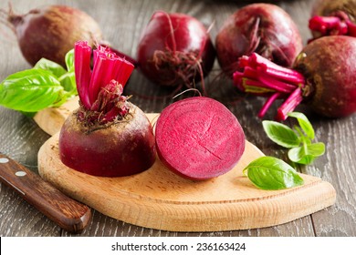 Young beets in a wooden bowl.