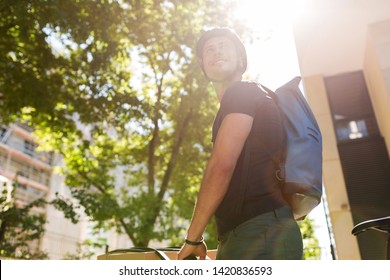 Young Bike Messenger Delivering Parcels