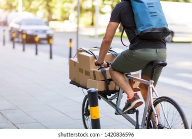 Young bike messenger delivering parcels