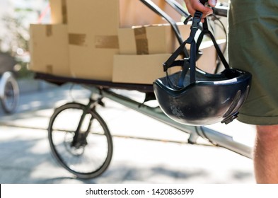 Young Bike Messenger Delivering Parcels