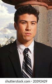 Young Biracial Businessman Standing Before A California Landscape